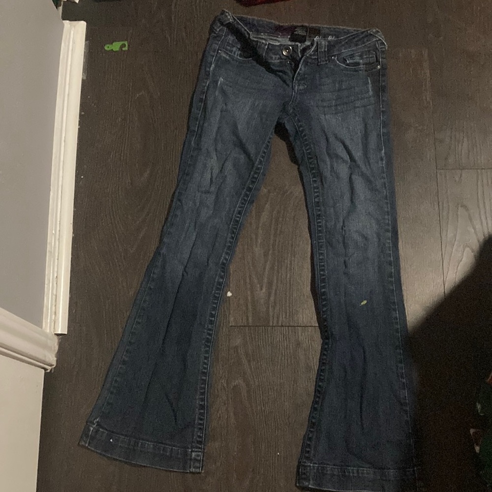 dark blue jeans from store: refuge.